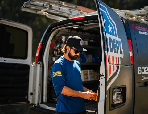 Phoenix Air Department technician at a service van